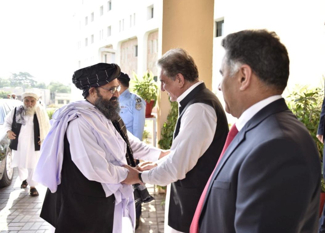 Pakistan's Foreign Minister Shah Mehmood Qureshi welcomes Mullah Abdul Ghani Baradar, who is leading Taliban Political Commission (TPC) delegation, upon his arrival at the Ministry of Foreign Affairs office in Islamabad, Pakistan October 3, 2019. (Photo courtesy: Ministry of Foreign Affairs (MoFA) Handout)