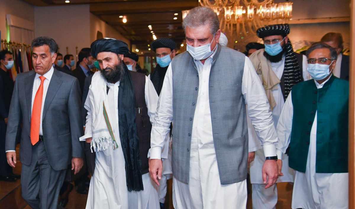 The photograph released by Pakistan's Ministry of Foreign Affairs shows Foreign Minister Shah Mahmood Qureshi, front, receiving Afghan Taliban delegation at the foreign office in Islamabad on Aug. 25, 2020. (Pakistan's Ministry of Foreign Affairs via AN)