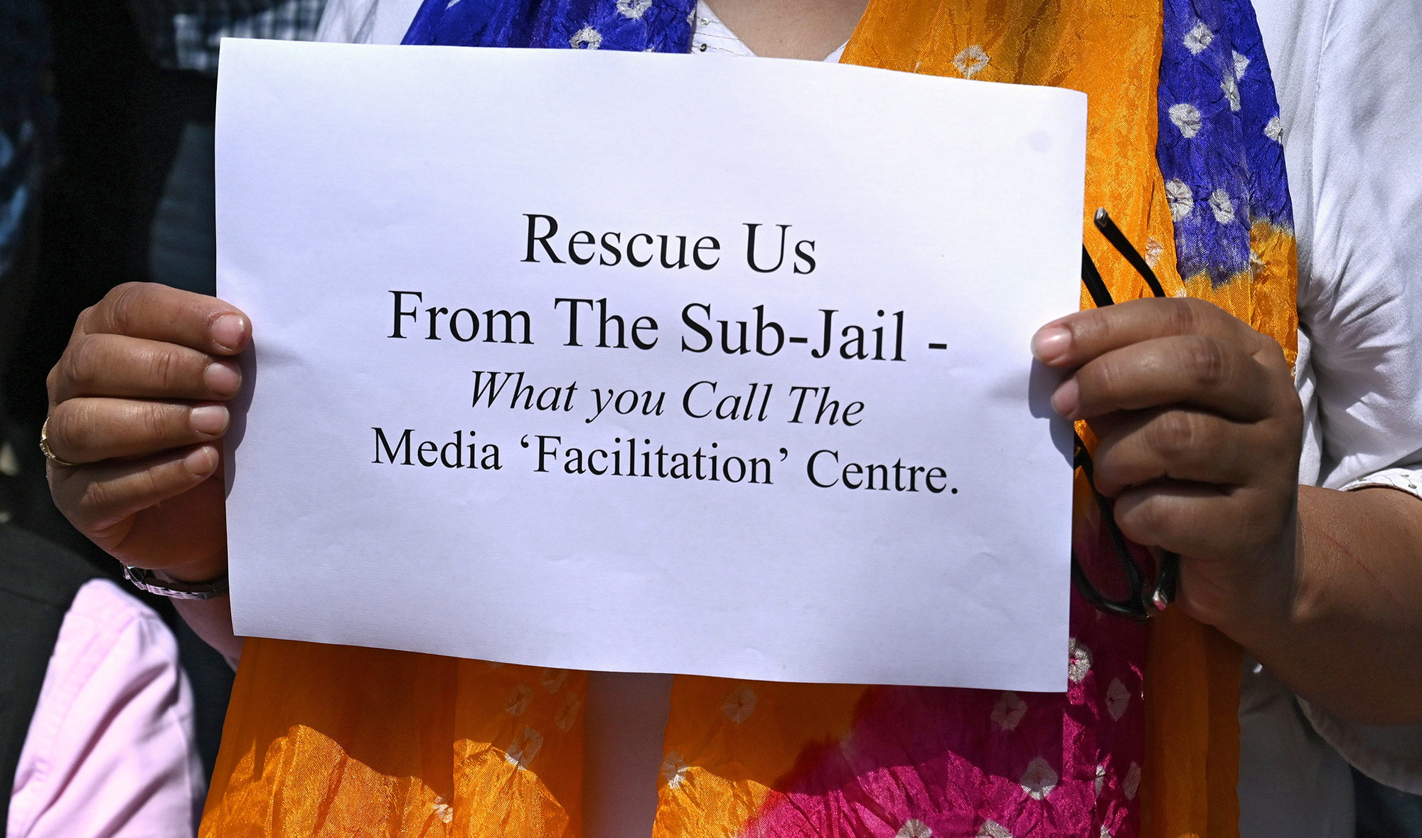 A journalist holds a sign during a protest against the restrictions on Internet and mobile phone networks at the Kashmir Press Club during a lockdown in Srinagar on Oct. 3, 2019. (AFP/File)
