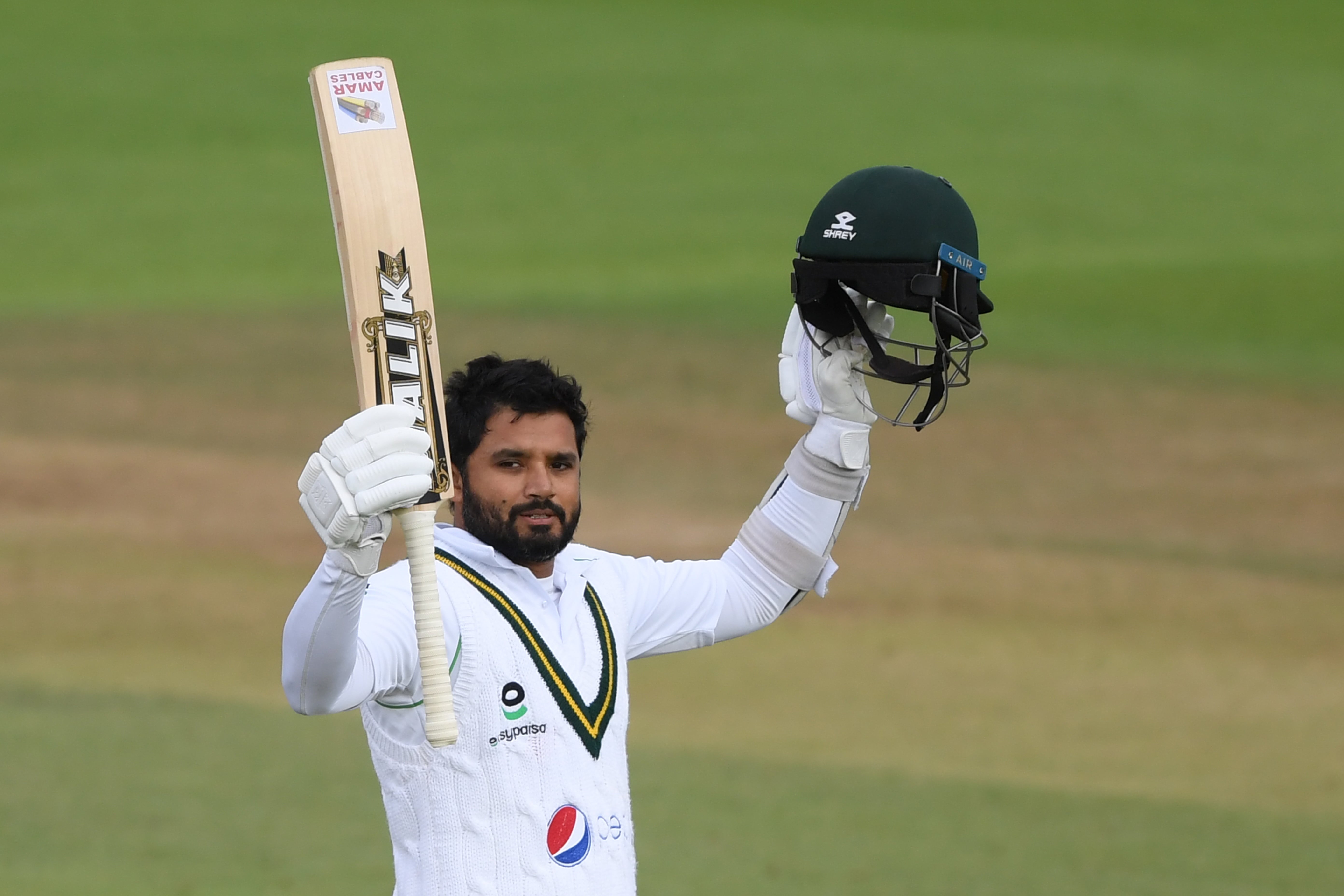 Pakistan's Azhar Ali celebrates after reaching his century on the third day of the third Test cricket match between England and Pakistan at the Ageas Bowl in Southampton, southern England on August 23, 2020. (AFP)