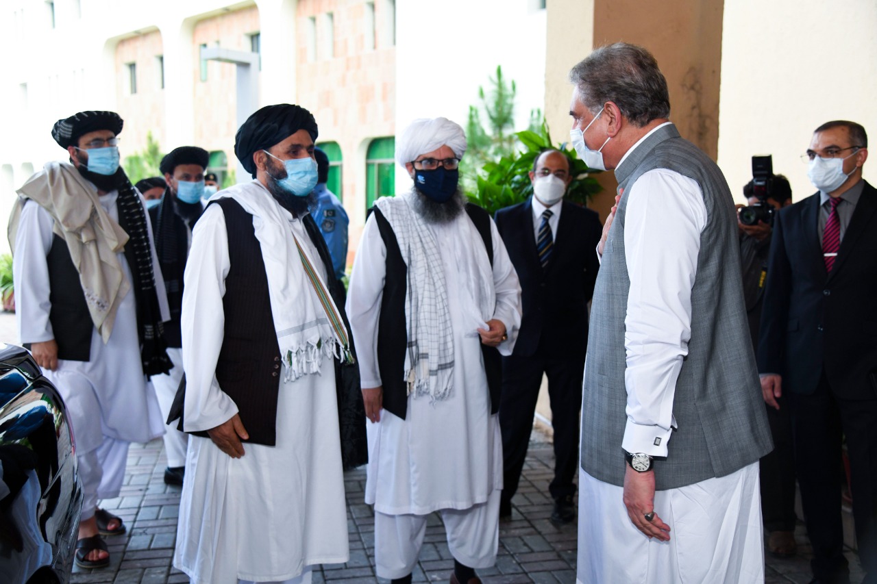 The photograph released by Pakistan's Ministry of Foreign Affairs shows Foreign Minister Shah Mahmood Qureshi, front, receiving Afghan Taliban delegation at the foreign office in Islamabad on Aug. 25, 2020. (Pakistan's Ministry of Foreign Affairs via AN)