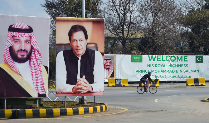 Billboards showing portraits of Saudi Arabian Crown Prince Mohammed bin Salman and Pakistan's Prime Minister Imran Khan displayed on a roadside ahead of the prince's arrival in Islamabad on Feb. 15, 2019. (AFP/File)