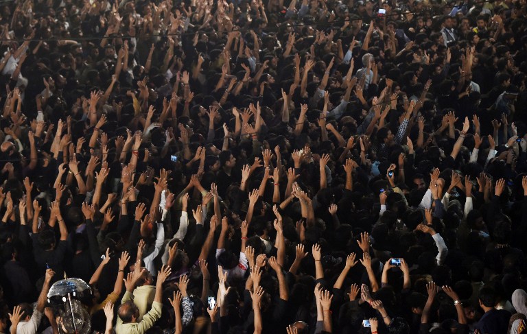 Pakistani Shiite Muslim devotees take part in an Ashura procession to commemorate the martyrdom of Imam Hussain, the grandson of Prophet Muhammad, in Lahore on October 24, 2015. (AFP)