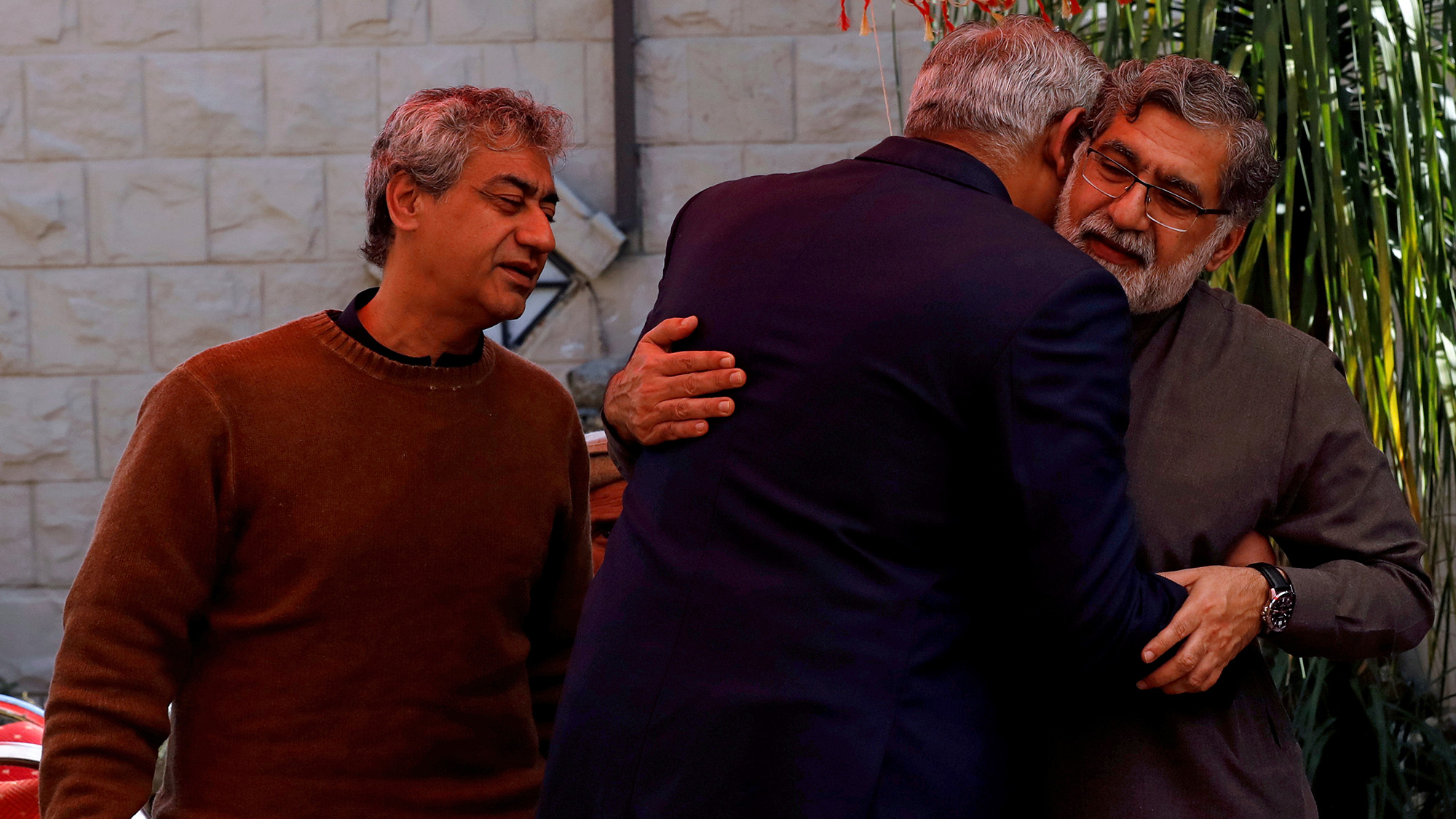 Family members of Naeem Rashid who was killed along with his son Talha Naeem in the Christchurch mosque attack in New Zealand, comfort each other during a condolence gathering at the family's home in Abbottabad on March 17, 2019. (REUTERS/File)