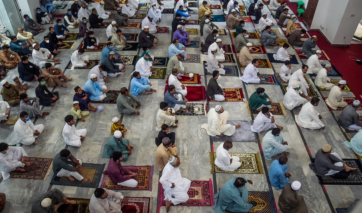 People offer prayers for the Eid Al-Adha, the feast of sacrifice, at a mosque in Rawalpindi on Aug. 1, 2020. (AFP)