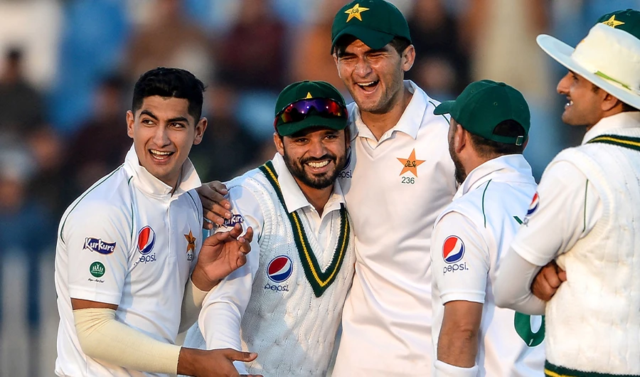 This file photo taken on February 7, 2020 shows Pakistan's Azhar Ali (2nd L) celebrating with teammates Naseem Shah (L) and Shaheen Shah Afridi (3rd L) after the dismissal of Bangladesh's Mohammad Mithun (unseen) during the first day of the first cricket Test match between Pakistan and Bangladesh at the Rawalpindi Cricket Stadium in Rawalpindi. (AFP)
