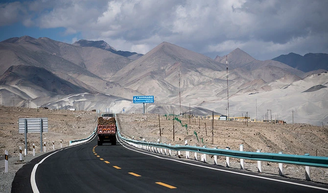 This picture taken on June 27, 2017 shows a truck driving along the China-Pakistan Friendship Highway before the Karakorum mountain range near Tashkurgan in China's western Xinjiang province. (AFP)