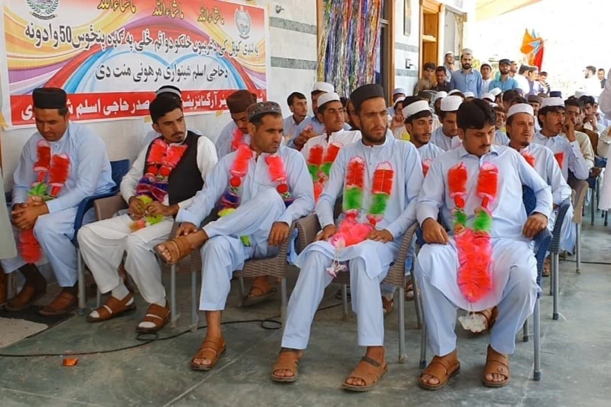 Garlanded grooms attend a mass wedding ceremony in Landikotal, Khyber Pakhtunkhwa on Aug. 5, 2020. (Photo courtesy: Shinwari Welfare Organization)
