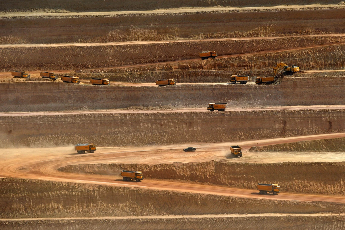 This picture taken on May 23, 2018 shows trucks transporting soil in an open-pit coal mining site at Islamkot in the desert in the Tharparkar district of Pakistan's southern Sindh province. (AFP/ File photo)