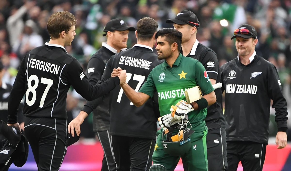 Pakistan's Babar Azam (3R) shakes hands with New Zealand's Lockie Ferguson (L) as he celebrates after victory in the 2019 Cricket World Cup group stage match between New Zealand and Pakistan at Edgbaston in Birmingham, central England, on June 26, 2019. (AFP)