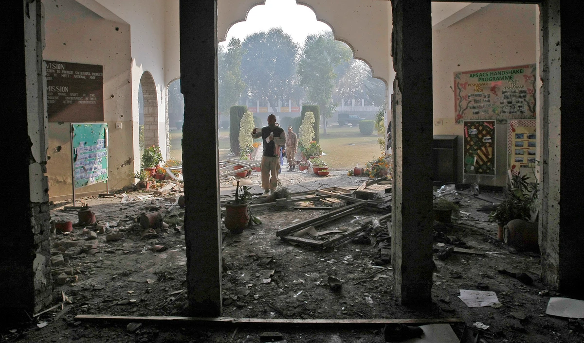 This photograph taken on Dec. 17, 2014 shows Pakistan Army soldiers inspecting the Army Public School in Peshawar that was attacked by Taliban gunmen a day before. (AP/File)