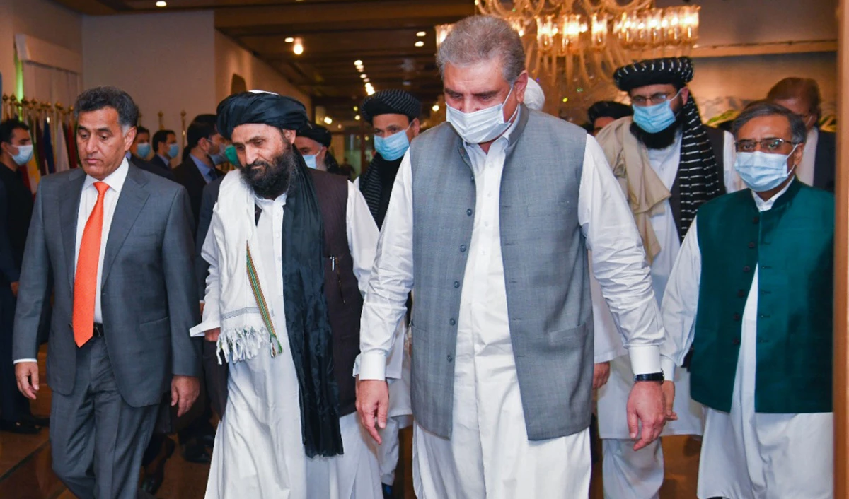 The photograph released by Pakistan's Ministry of Foreign Affairs shows Foreign Minister Shah Mahmood Qureshi, front, receiving Afghan Taliban delegation at the foreign office in Islamabad on Aug. 25, 2020. (Pakistan's Ministry of Foreign Affairs via AN)