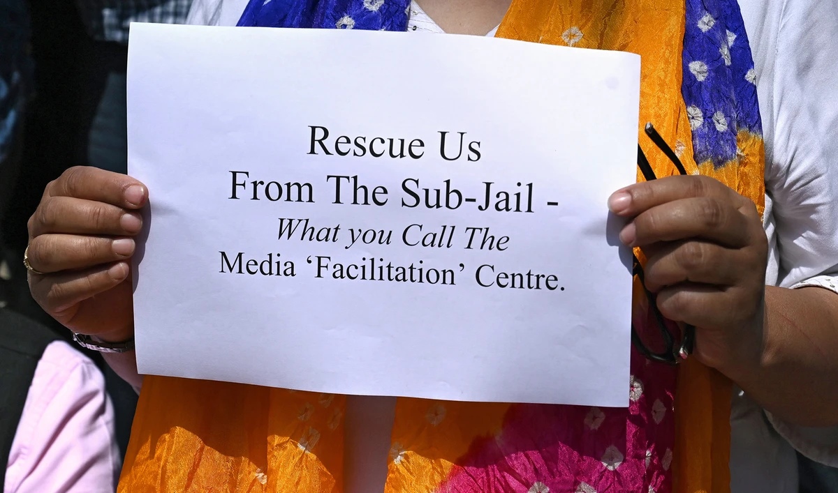 A journalist holds a sign during a protest against the restrictions on Internet and mobile phone networks at the Kashmir Press Club during a lockdown in Srinagar on Oct. 3, 2019. (AFP/File)