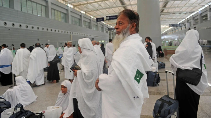 In this file photo Pakistani pilgrims wait in queue to clear security as part of the first group to arrive in Jeddah, Saudi Arabia for Hajj on July 24, 2017. (AFP/File)