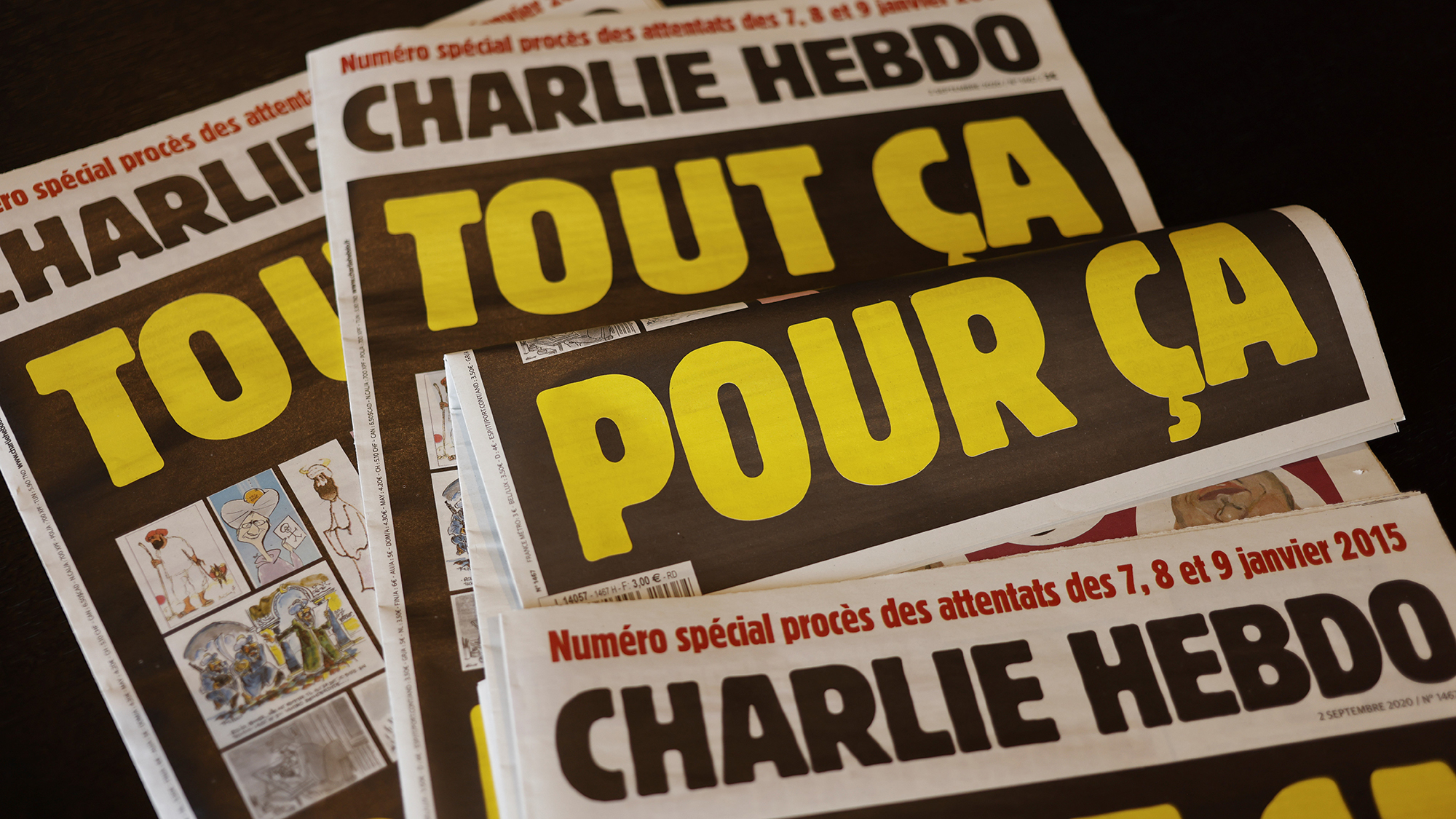 This picture taken on September 1, 2020 in Paris shows covers of French satirical weekly Charlie Hebdo reading "All of this, just for that," published on September 2 to mark this week's start of the trial for 14 accused in January 2015 attacks in Paris. - Twelve people, including some of France's most celebrated cartoonists, were killed on January 7, 2015, when brothers Said and Cherif Kouachi went on a gun rampage at the paper's offices. (AFP)