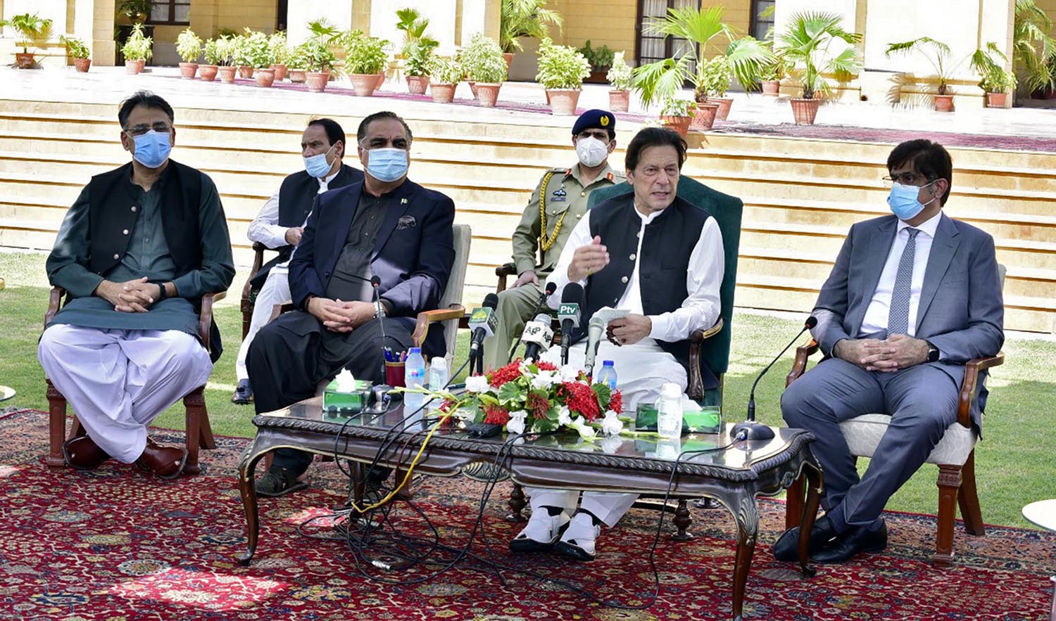 Pakistan Prime Minister Imran Khan flanked by Sindh Chief Minister Murad Ali Shah, right, and Sindh Governor Imran Ismail, speaks during a press conference in Karachi on Sept.5, 2020. (PID)