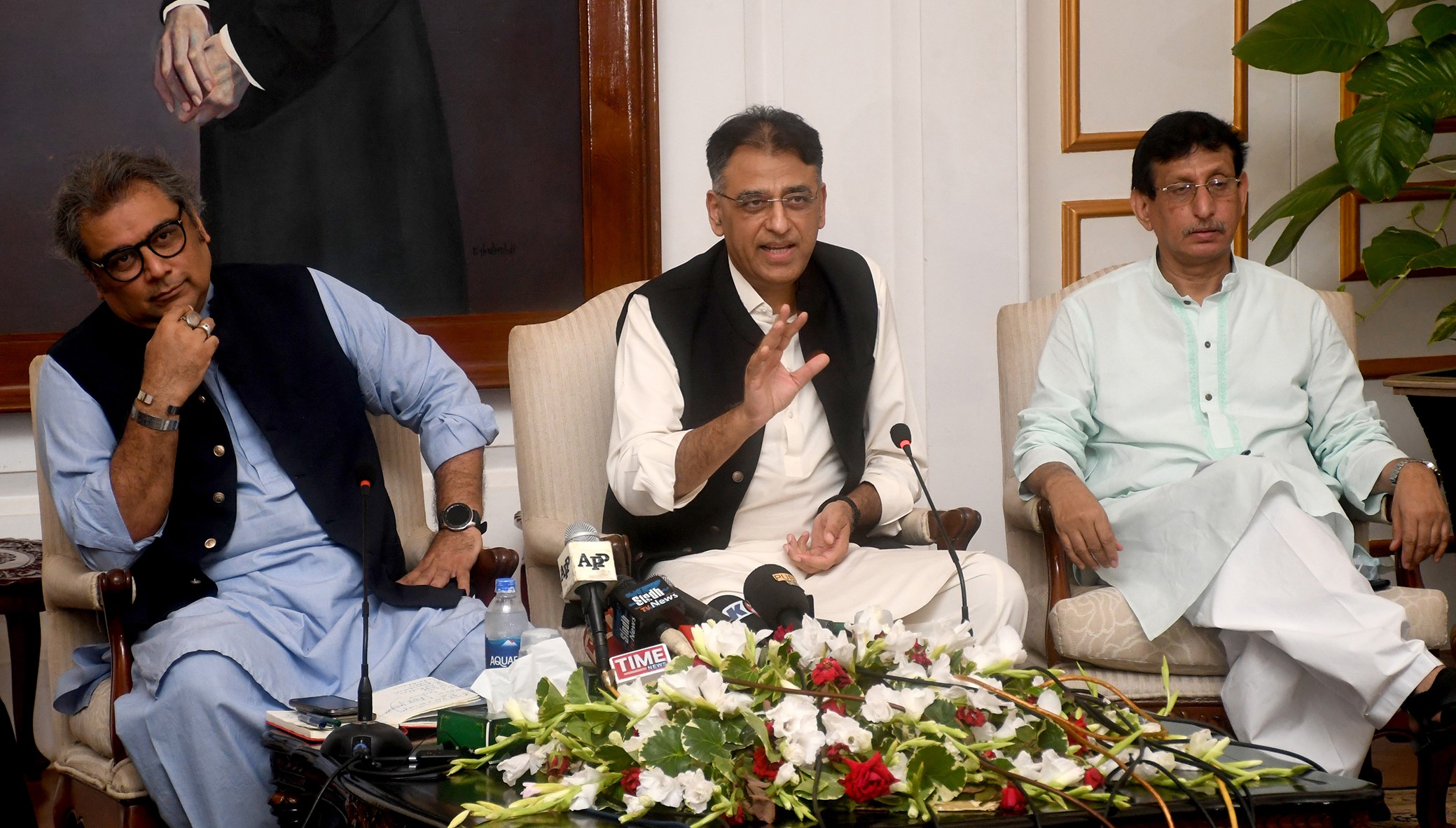Planning and Development Minister Asad Umar is addressing a press conference alongside Maritime Affairs Minister Ali Haider Zaidi and Telecommunications Minister Syed Amin Ul Haque, at Governor House, Karachi, on Sept. 6, 2020. (PID)