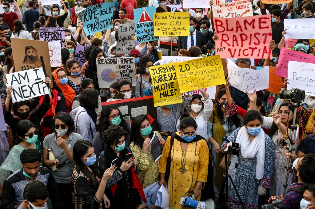 Hundreds of protesters take to the streets of Lahore across Pakistan on Sept. 12, 2020 protesting gruesome gang rape of a woman in front of her two children after her car ran out of fuel near the city on Sept. 9. (AFP)
