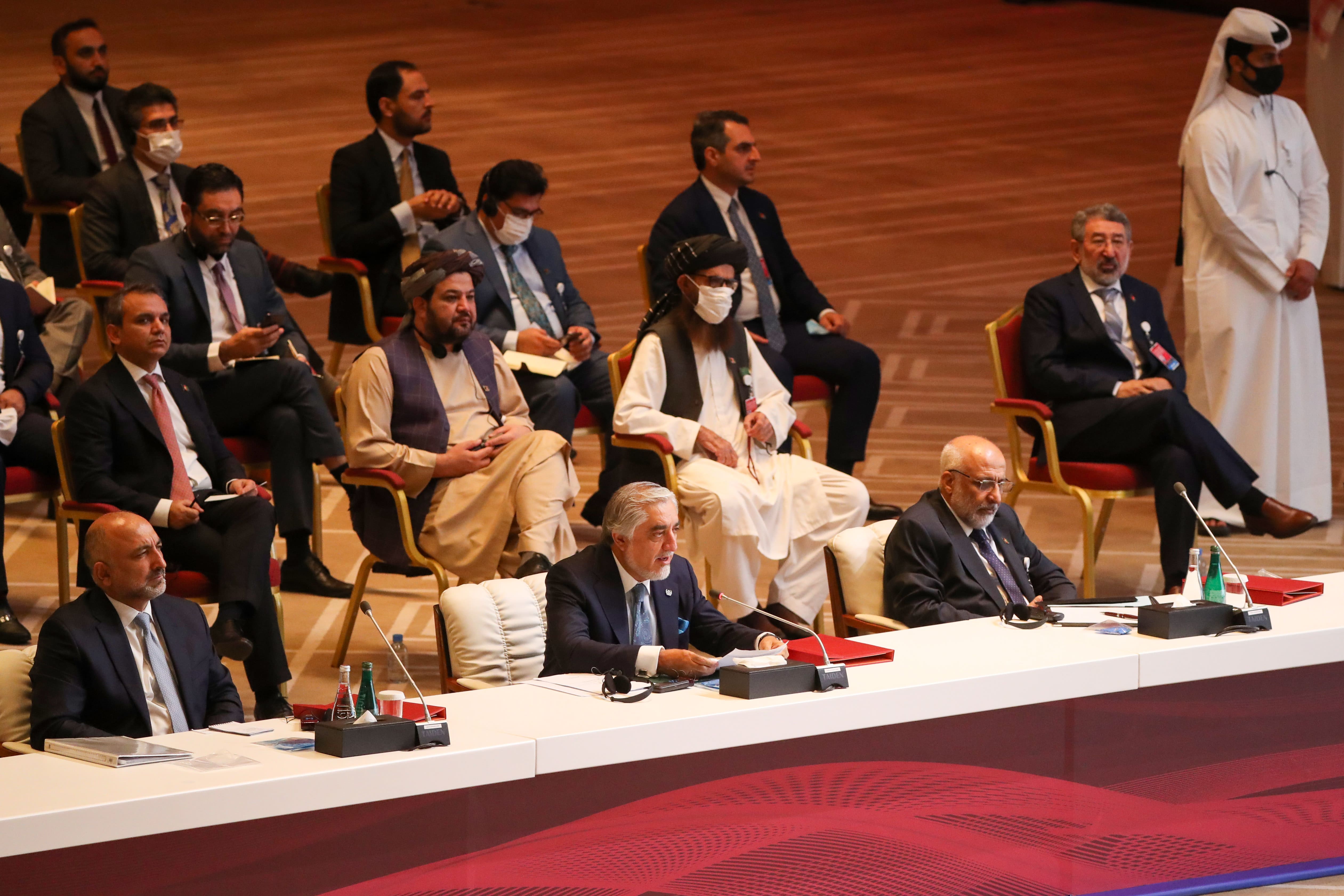 Abdullah Abdullah, center, chairman of Afghanistan's High Council for National Reconciliation, speaks att the opening session of intra-Afghan talks between the Afghan government and the Taliban in the Qatari capital Doha on Sept. 12, 2020. (AFP)
