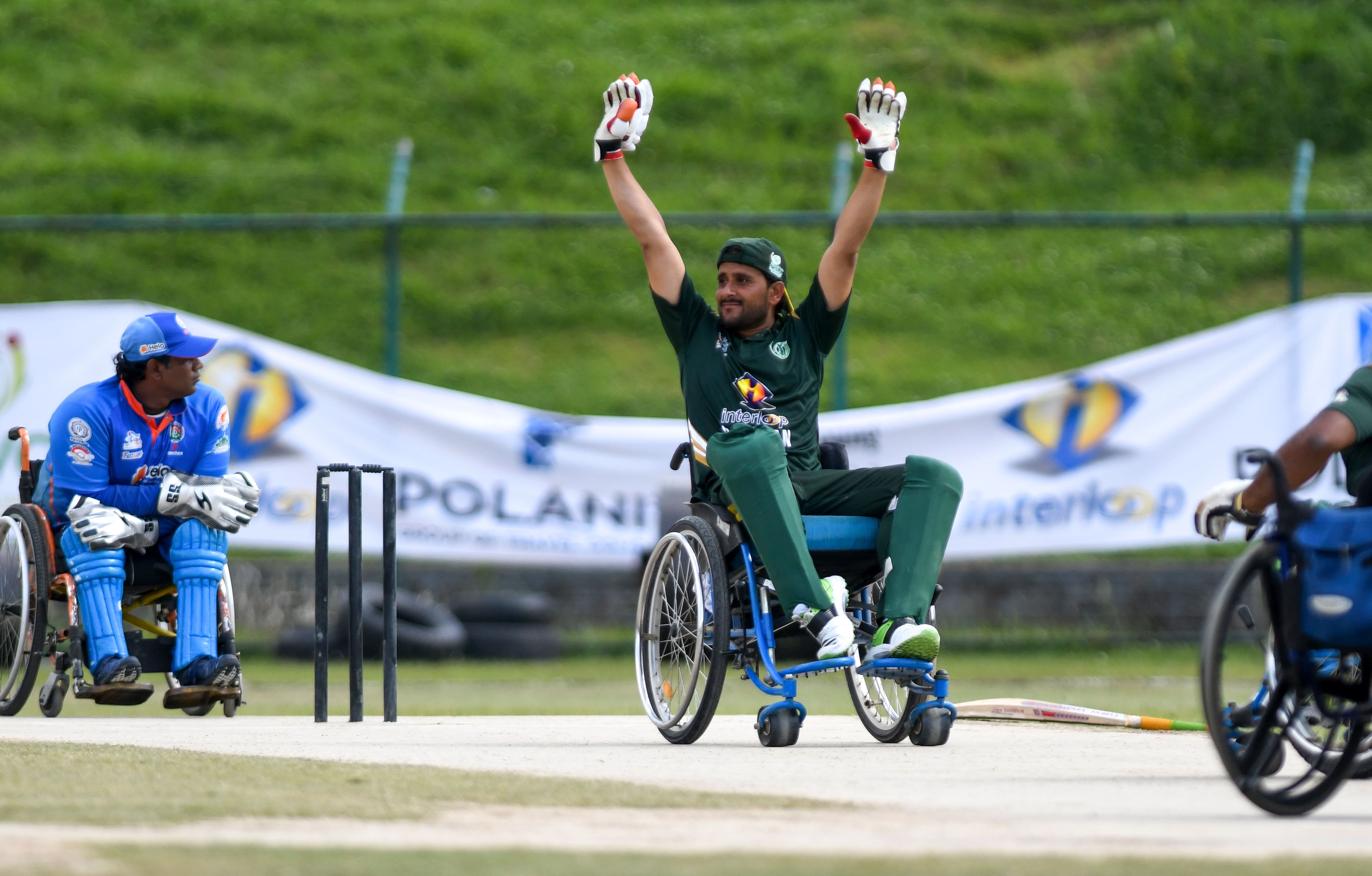 Pakistan's wheelchair cricket player Muhammad Latif (C) celebrates his century during the Asia Cup Twenty 20 wheelchair cricket tournament final match between India and Pakistan at Kirtipur Cricket Ground in Kathmandu on May 18, 2019. (AFP)
