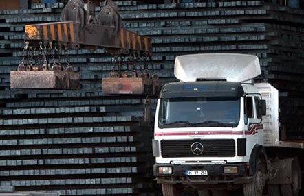 In this undated photo, a truck with a steel bar shipment is being unloaded at Agha Steel Industries in Karachi, Pakistan. (Photo courtesy of Agha Steel Industries)
