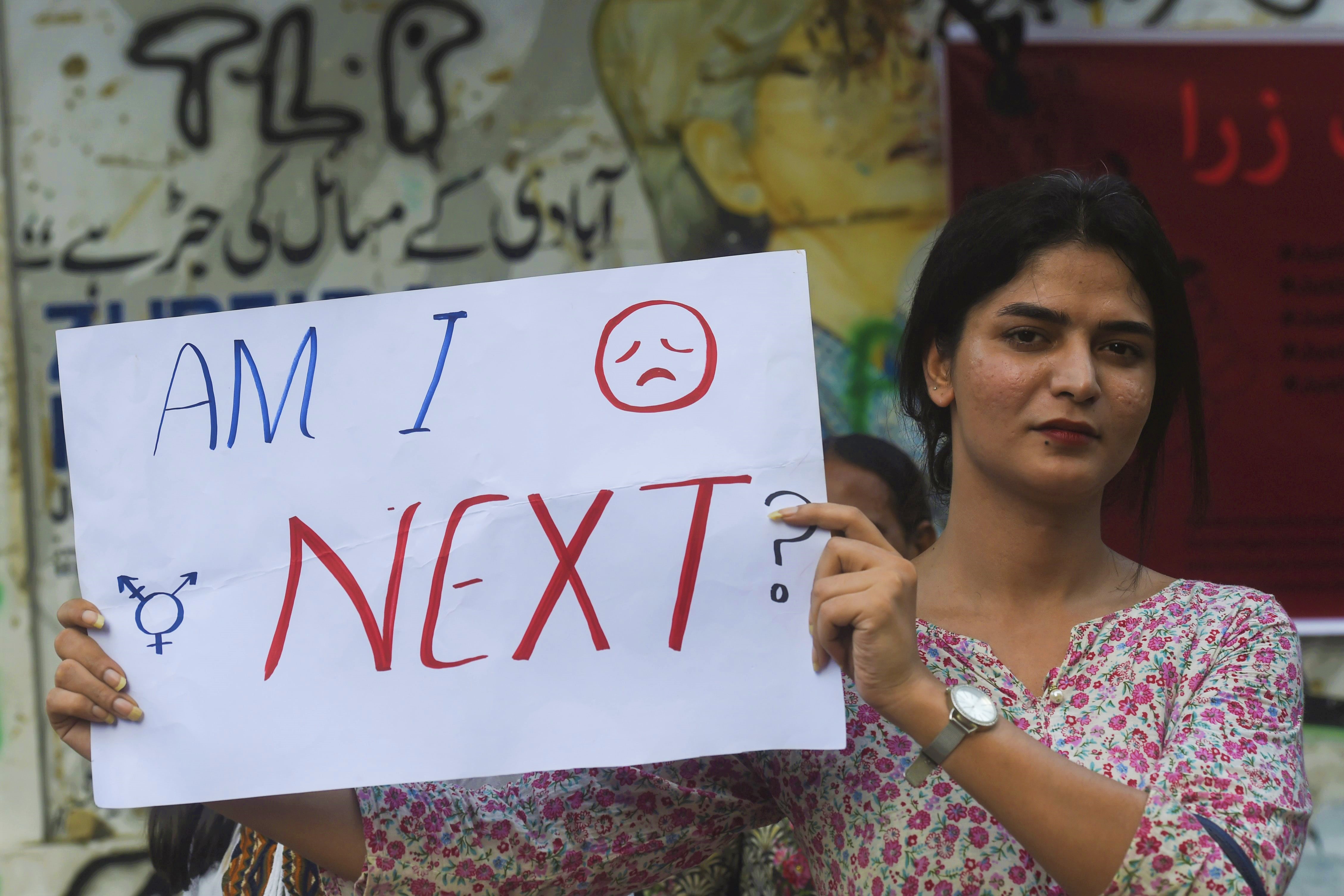 A demonstrator holds a placard during a protest against an alleged gang rape of a woman, in Karachi on September 18, 2020. (AFP)