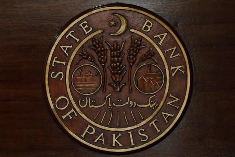 A logo of the State Bank of Pakistan (SBP) is pictured on a reception desk at the head office in Karachi, Pakistan July 16, 2019. (REUTERS)