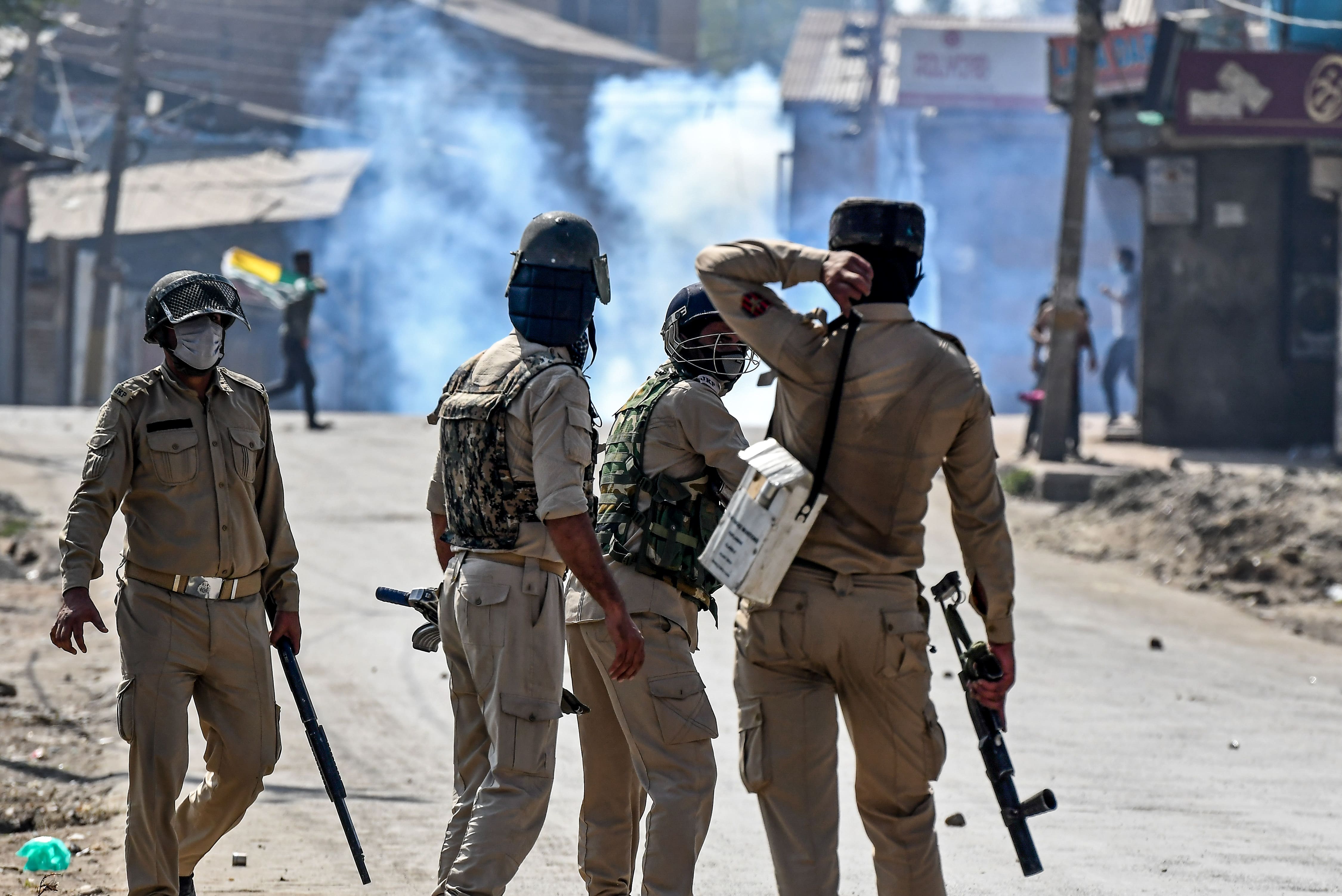 Security personnel watch a street during clashes between protesters and government forces in Batamaloo area of Srinagar on September 17, 2020. (AFP)