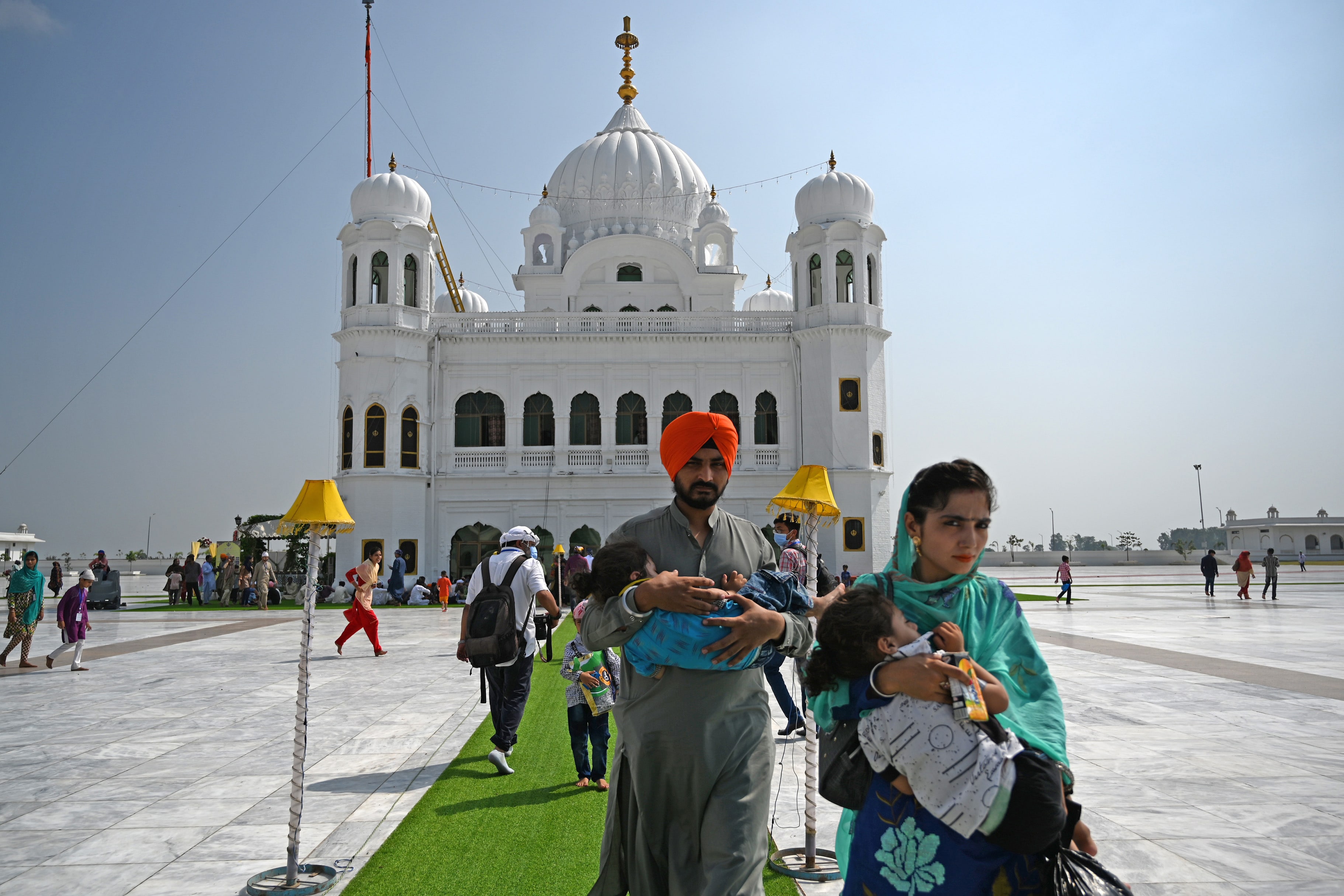 Sikh pilgrims arrive to take part in a religious ritual on the occasion of the 481st death anniversary of Baba Guru Nanak Dev Ji, the founder of Sikhism, at the Gurdwara Darbar Sahib in Kartarpur near the India-Pakistan border on September 22, 2020. (AFP)