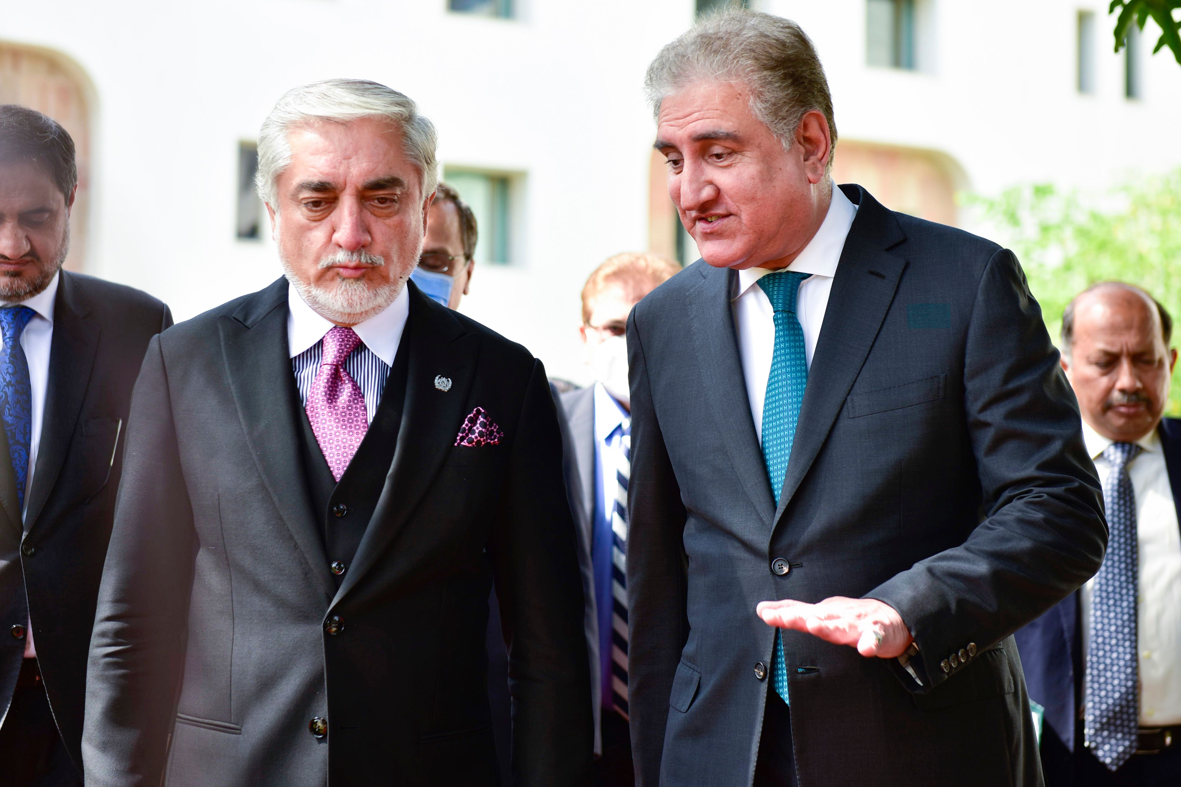 In this handout picture taken and released by Pakistan Ministry of Foreign Affairs on September 28, 2020, Chairman of the High Council for National Reconciliation of Afghanistan Abdullah Abdullah (2L) listens to the Pakistani Foreign Minister Shah Mahmood Qureshi (R) during his visit at the Ministry of Foreign Affairs in Islamabad. (AFP via Pakistan Ministry of Foreign Affairs)