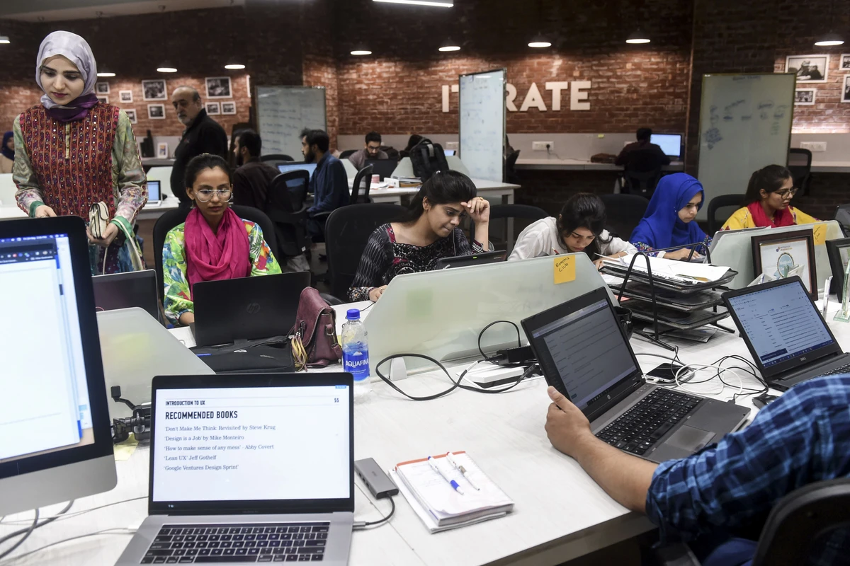 In this photograph taken on May 24, 2019, Pakistani youngsters work at their desks at the National Incubation Centre (NIC) in Lahore, Pakistan. (AFP)
