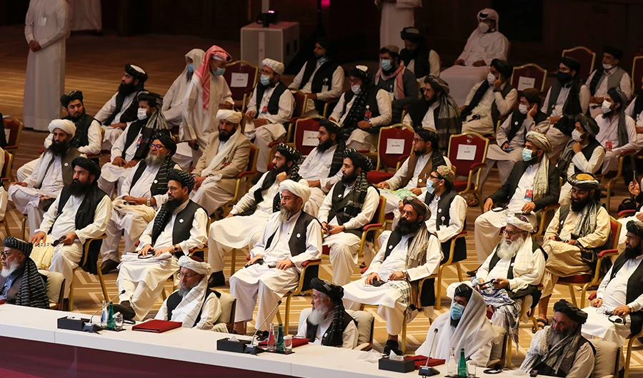 Members of the Taliban delegation attend the opening session of the peace talks between the Afghan government and the Taliban in the Qatari capital Doha on September 12, 2020. (AFP)