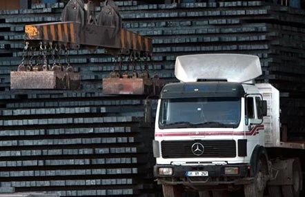 In this undated photo, a truck with a steel bar shipment is being unloaded at Agha Steel Industries in Karachi, Pakistan. (Photo courtesy of Agha Steel Industries)