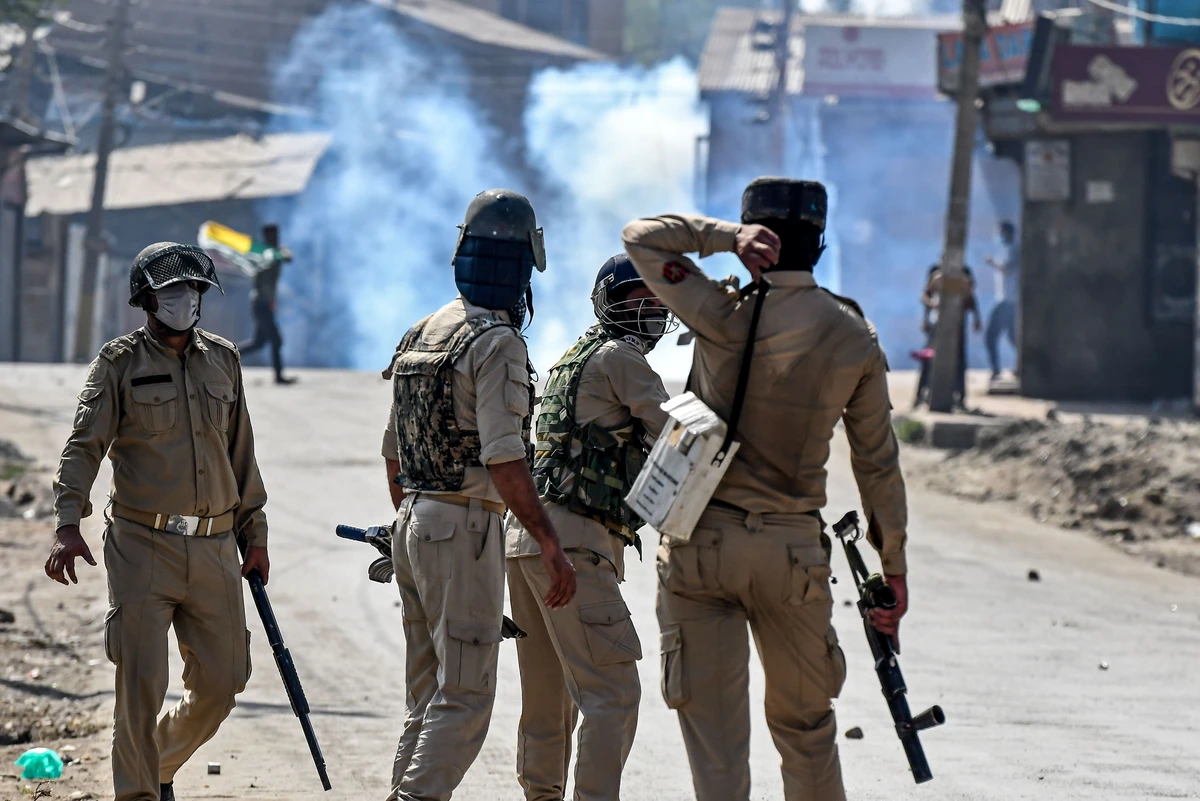 Security personnel watch a street during clashes between protesters and government forces in Batamaloo area of Srinagar on September 17, 2020. (AFP)