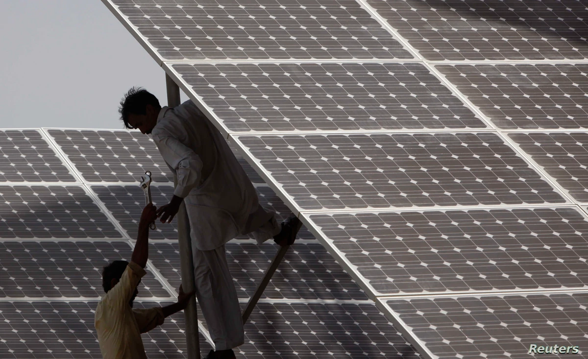 In this file photo, technicians work on solar panel in power station at Hub about 25 km from Karachi on June 18, 2010. Pakistan plans to increase the share of its power generation coming from renewable sources to 20 percent by 2025, and to 30 percent by 2030. (REUTERS/File)