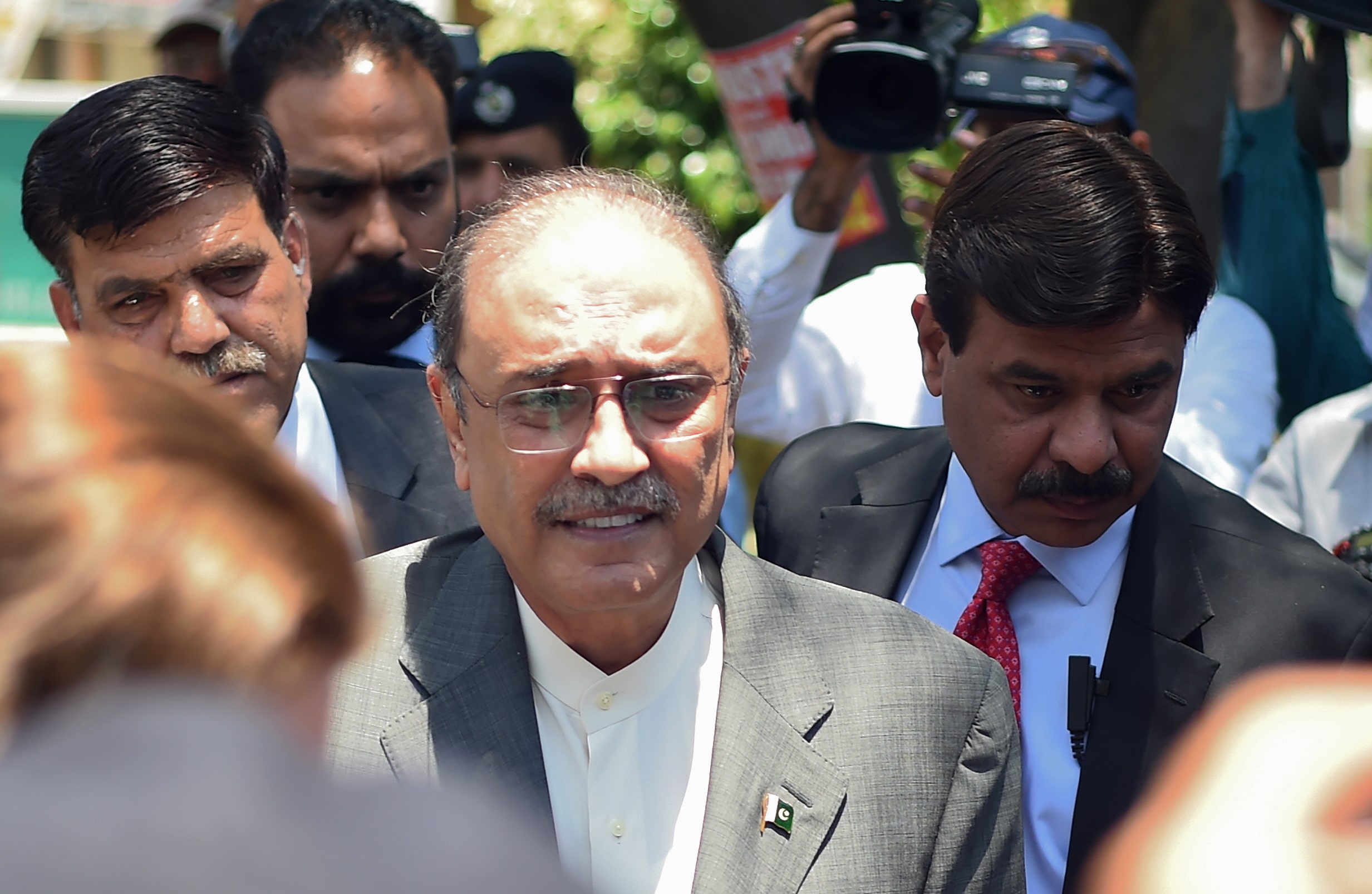 Former Pakistani President and the co-chairperson of Pakistan People's Party (PPP) Asif Ali Zardari (2L) arrives for his bail appeal at Islamabad High Court on June 10, 2019. (AFP)