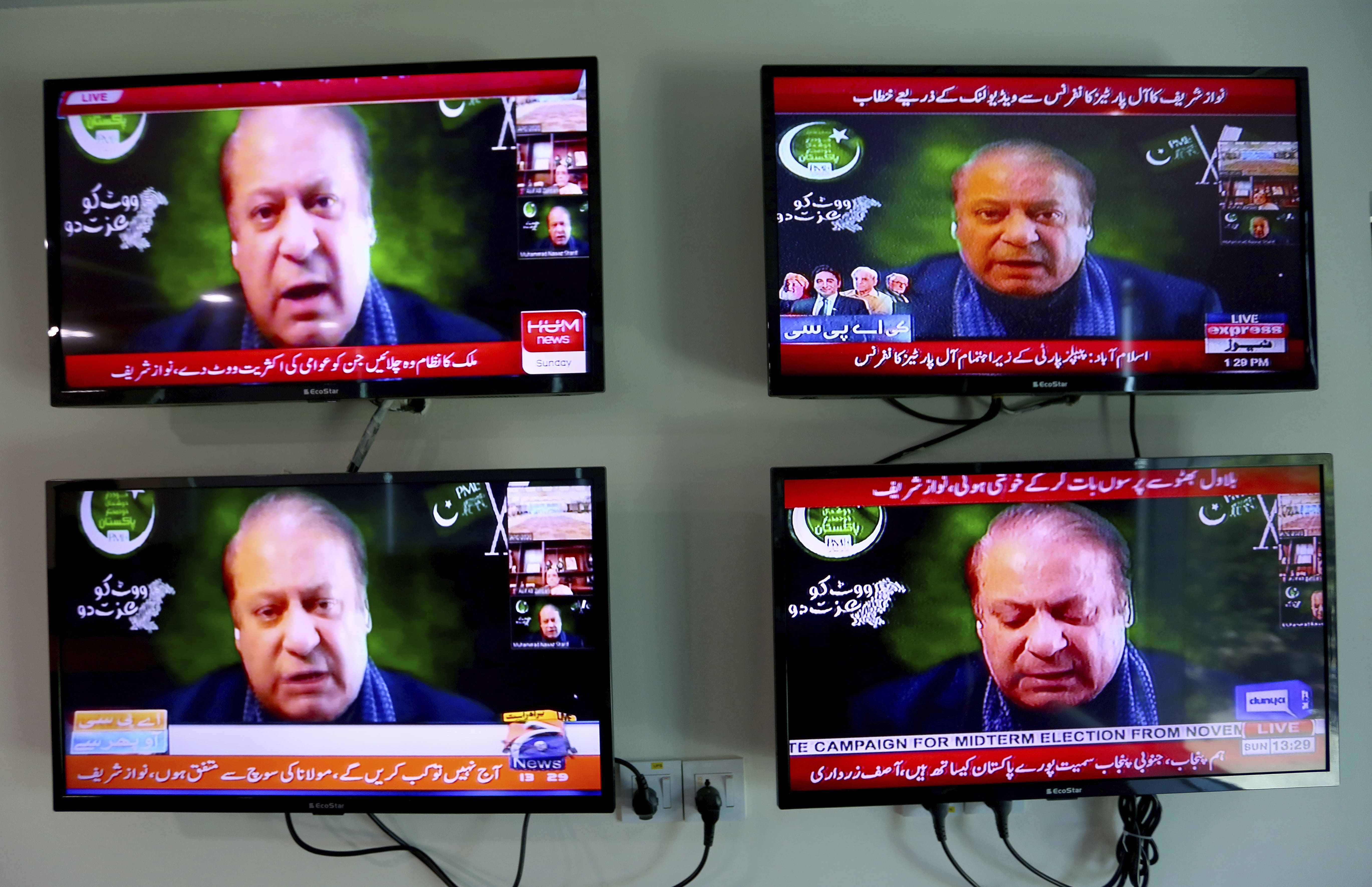 In this Sept. 21, 2020 file photo, Pakistani news channels telecast live of Pakistan's ailing former Prime Minister Nawaz Sharif addressing to an opposition parties meeting in Islamabad, Pakistan. (AP)
