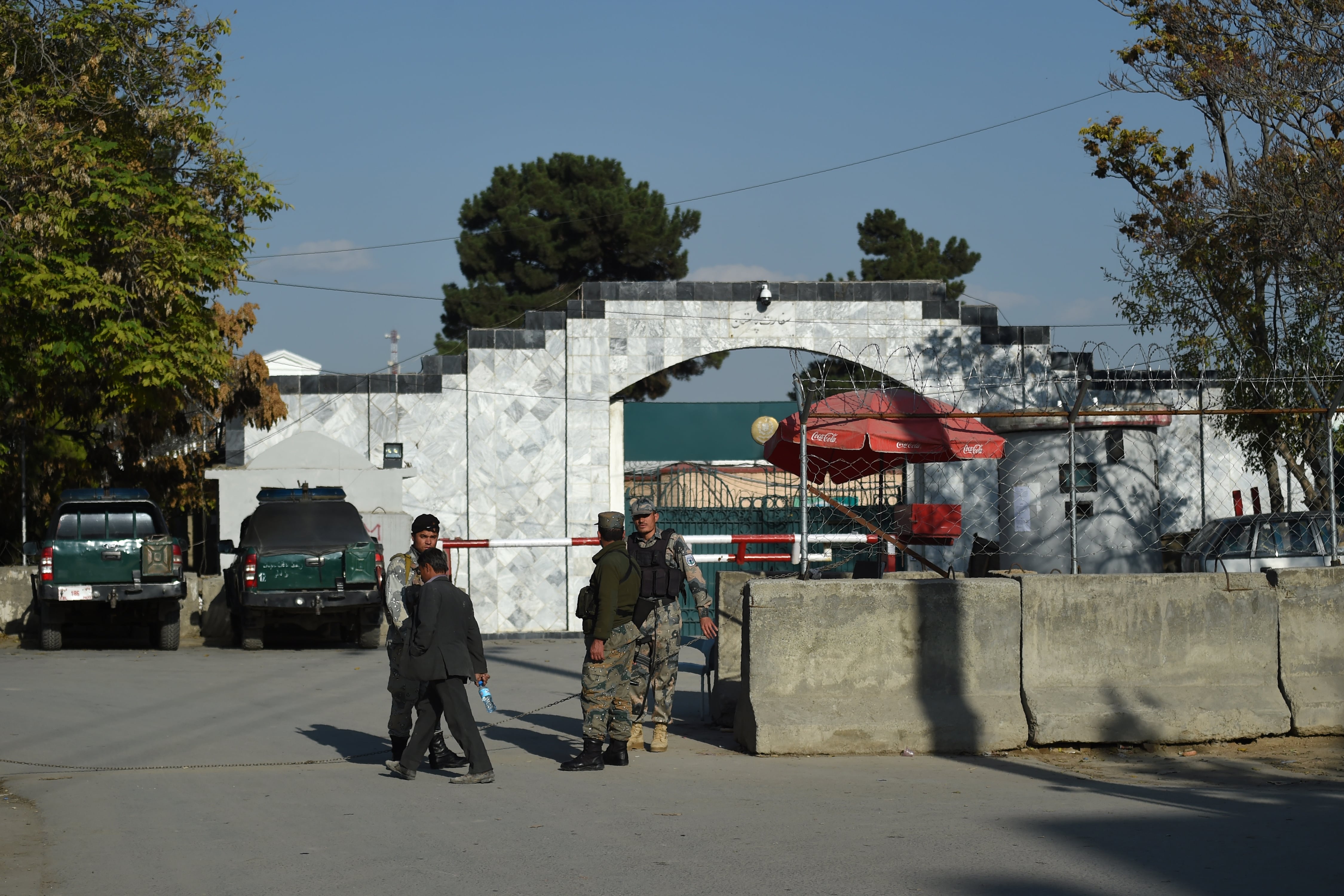 Afghan police personnel stand guard outside Pakistan's embassy, in Kabul on November 4, 2019. Hundreds of Afghans -- many needing urgent medical treatment -- gathered near the Pakistani embassy in Kabul on November 4, waiting for word of when the visa section might re-open. (AFP)