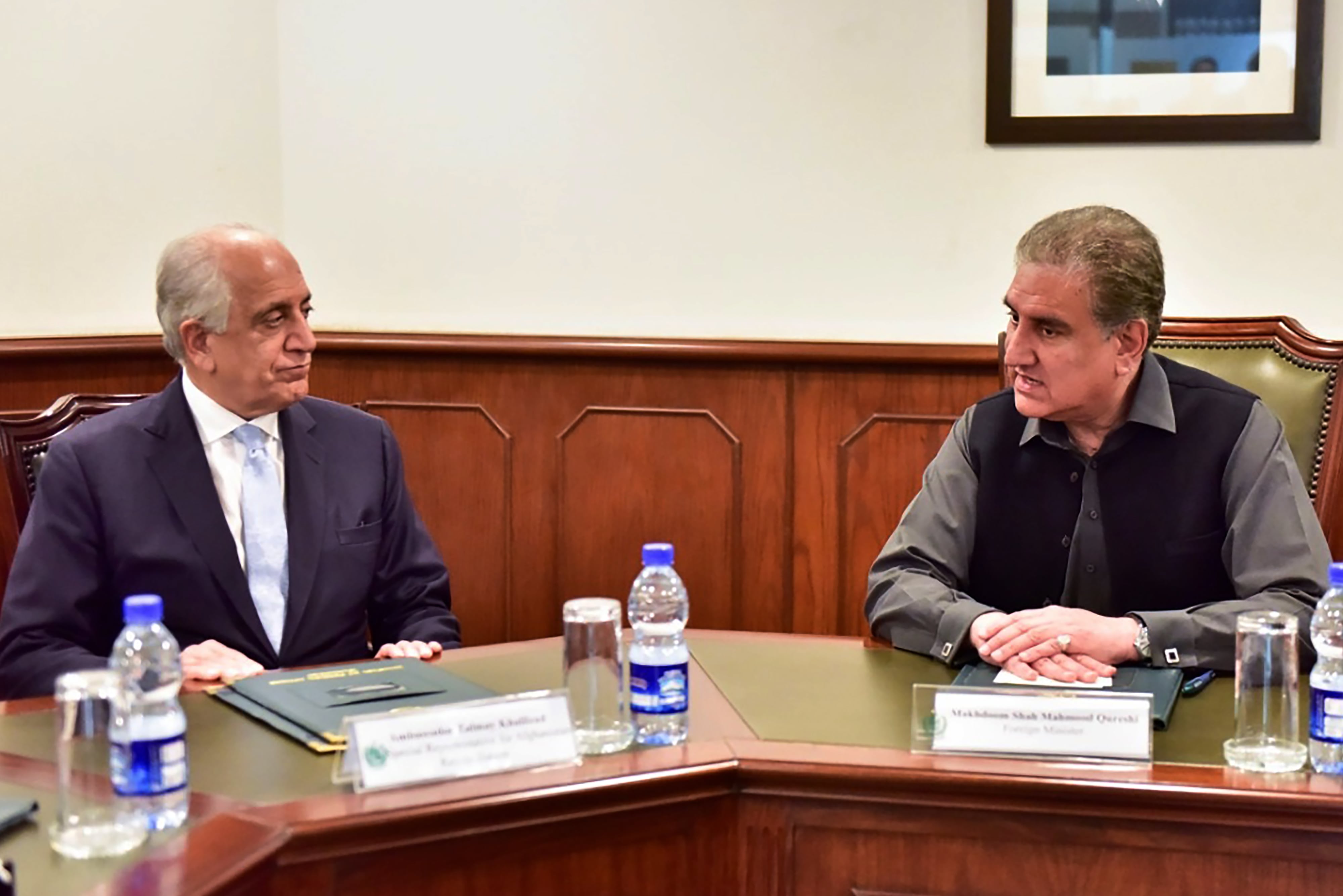 In this handout picture taken and released by Pakistan's Ministry of Foreign Affairs on January 31, 2020, Pakistan's Foreign Minister Shah Mahmood Qureshi (R) speaks US envoy Zalmay Khalilzad, the US Special Representative for Afghanistan Reconciliation, at the Foreign Ministry in Islamabad. (AFP)