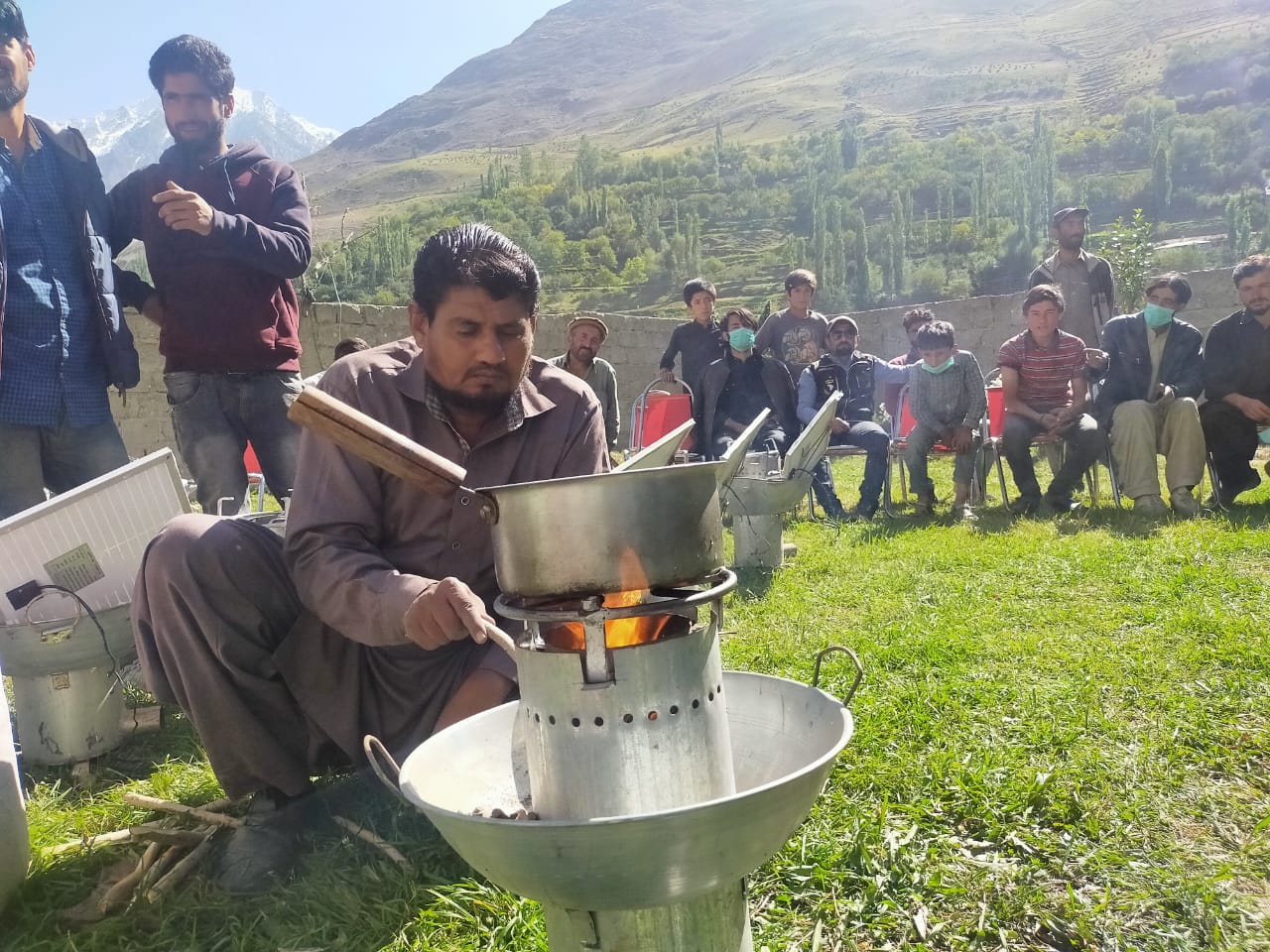 In this photo from September 2020, locals in Pakistan's Gilgit-Baltistan region use gasifier stoves that produces fuel from agro-waste, forest logging and animal dung. (Photos courtesy: WWF-Pakistan)
