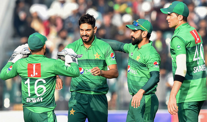 In this file photo taken on January 25, 2020 Pakistan's Haris Rauf (2ndL) celebrates with teammates the wicket of Bangladesh's Mahmudullah Riyad during the second T20 international cricket match of a three-match series between Pakistan and Bangladesh, at the Gaddafi Cricket Stadium in Lahore. (AFP)