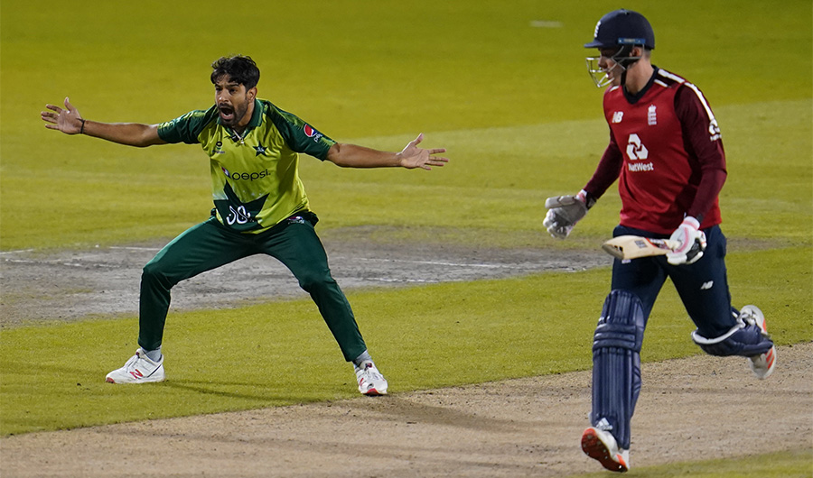 Pakistan's Haris Rauf (L) celebrates the dismissal of England's Tom Banton during the international Twenty20 cricket match between England and Pakistan at Old Trafford cricket ground in Manchester, north-west England, on September 1, 2020. (AFP)