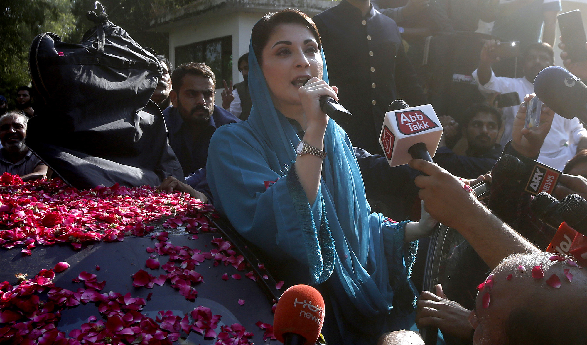 Maryam Nawaz, daughter of former Pakistani Prime Minister Nawaz Sharif and leader of an opposition party, addresses supporters while leaving her home to attend a rally in Lahore on Oct. 16, 2020. (AP)