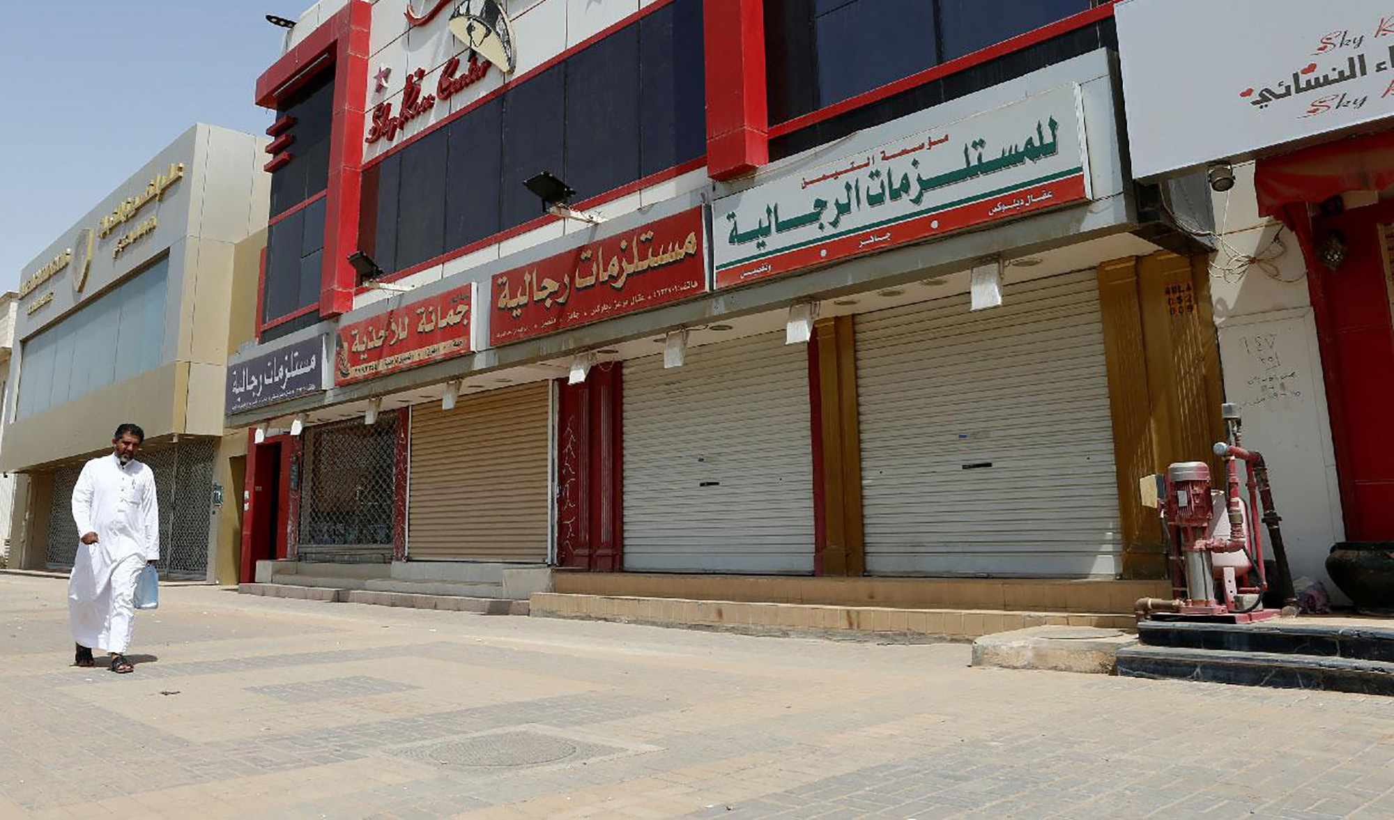 A man walks next to closed shops in Riyadh on July 12, 2018. (REUTERS/File)