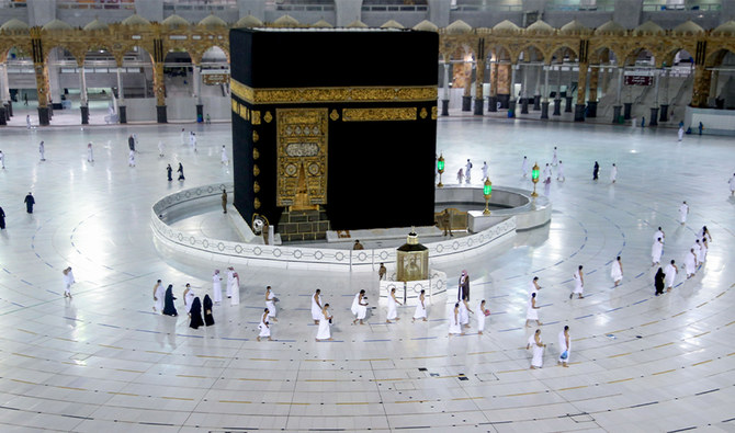 Saudis and foreign residents circumambulate (Tawaf) the Kaaba in the Grand Mosque complex in the holy city of Makkah, on October 4, 2020. (AFP)