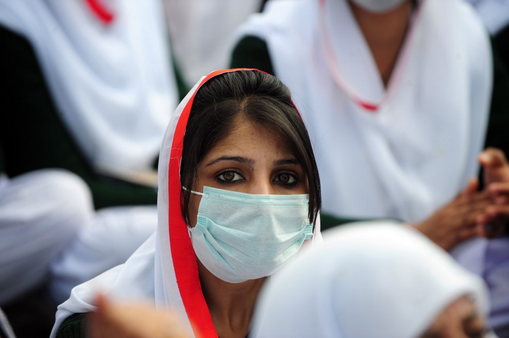 In this file photo, a Pakistani paramedic sits with others at a protest rally in Islamabad on January 31, 2012. (AFP/File)