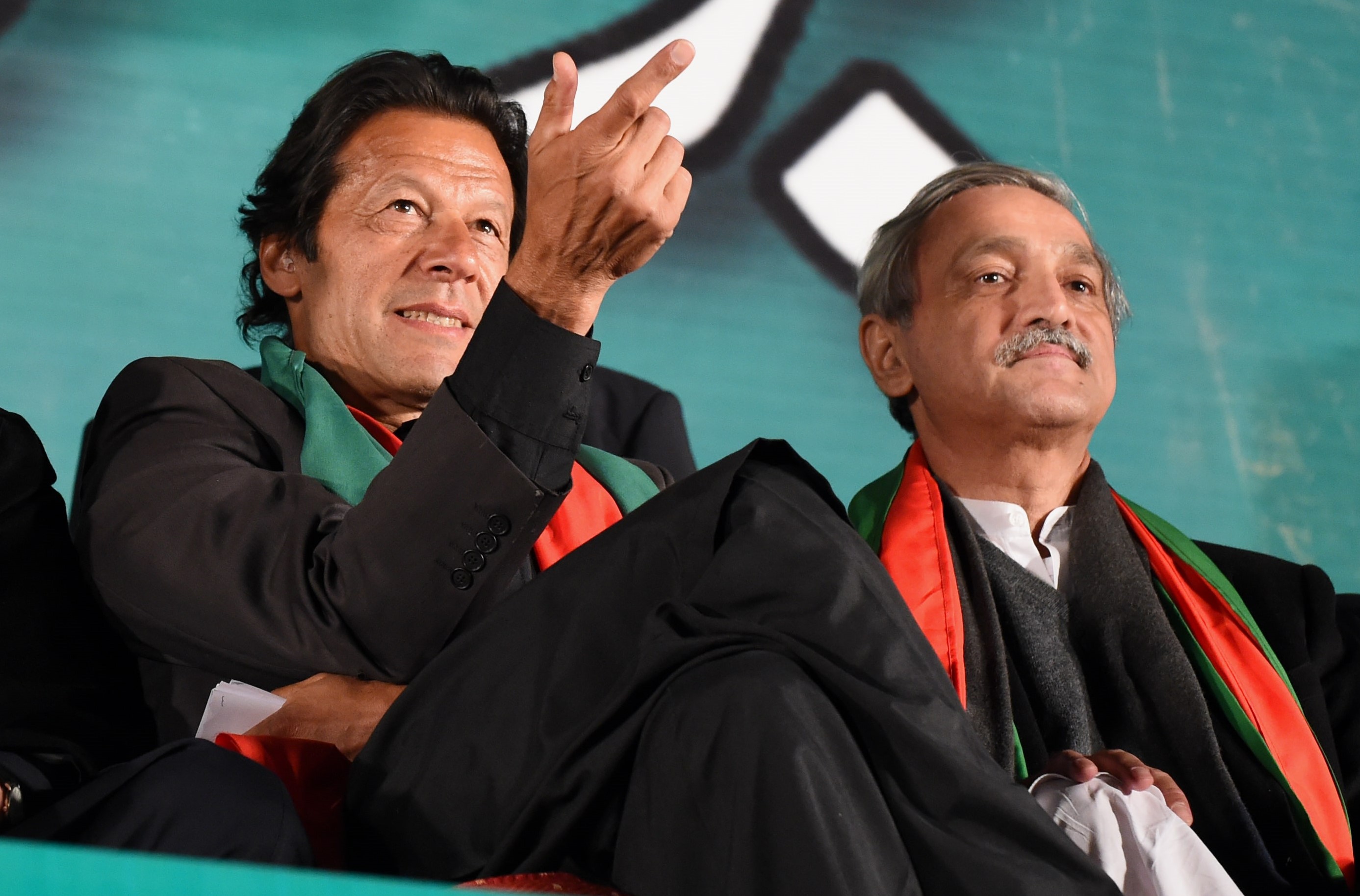 In this file photo, Pakistan Tehreek-i-Insaf (PTI) leaders Imran Khan and Jahangir Tareen are seen at a rally in Islamabad on November 30, 2014. (AFP/File)