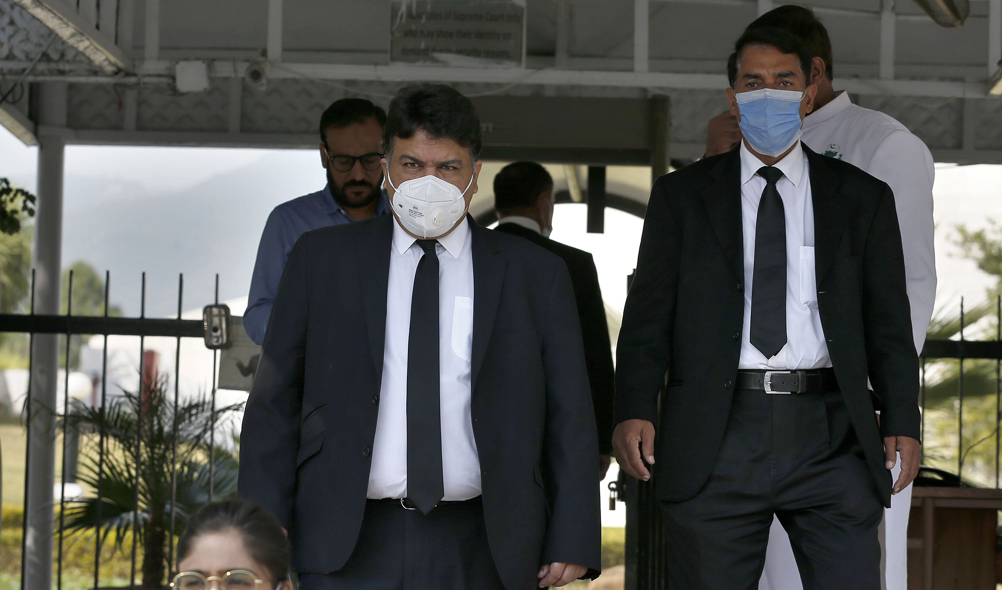 Faisal Siddiqi, center, a lawyer for the family of Daniel Pearl, an American reporter who was kidnapped and killed in Pakistan, leaves after an appeal hearing in the case, at the Supreme Court, in Islamabad on Oct. 22, 2020. (AP)