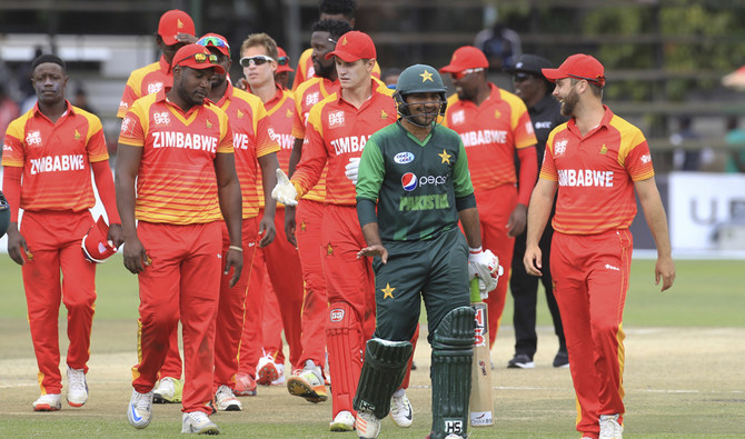 Pakistan's batsman Sarfraz Ahmed, center, shares a light moment with Zimbabwean players after winning the T20 cricket match at Harare Sports Club, on July 4, 2018. (AP/File)