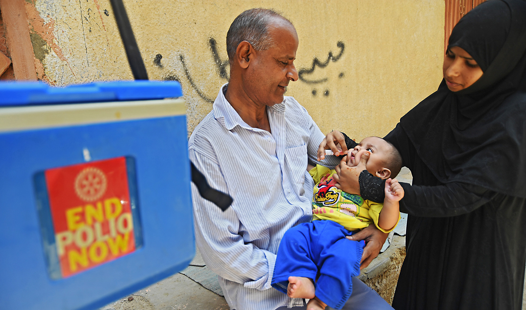 A Pakistani health worker administers polio vaccine drops to a child during a polio vaccination campaign in Karachi on May 7, 2018. (AFP/File)